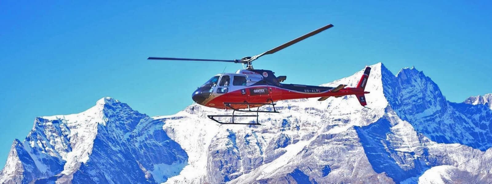 A helicopter presenting the Halesi Mahadev Temple complex and adjacent scenery as it flies above the area.