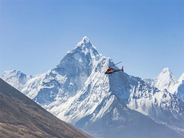 a helicopter tour, an aerial view of Mount Everest and the surrounding Himalayan terrain